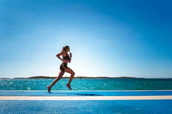 Woman running showing strong leg muscle Handsworth